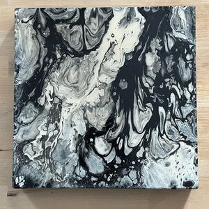 Acrylic pour abstract art canvases in black, white, and silver colors. 12” x 12”